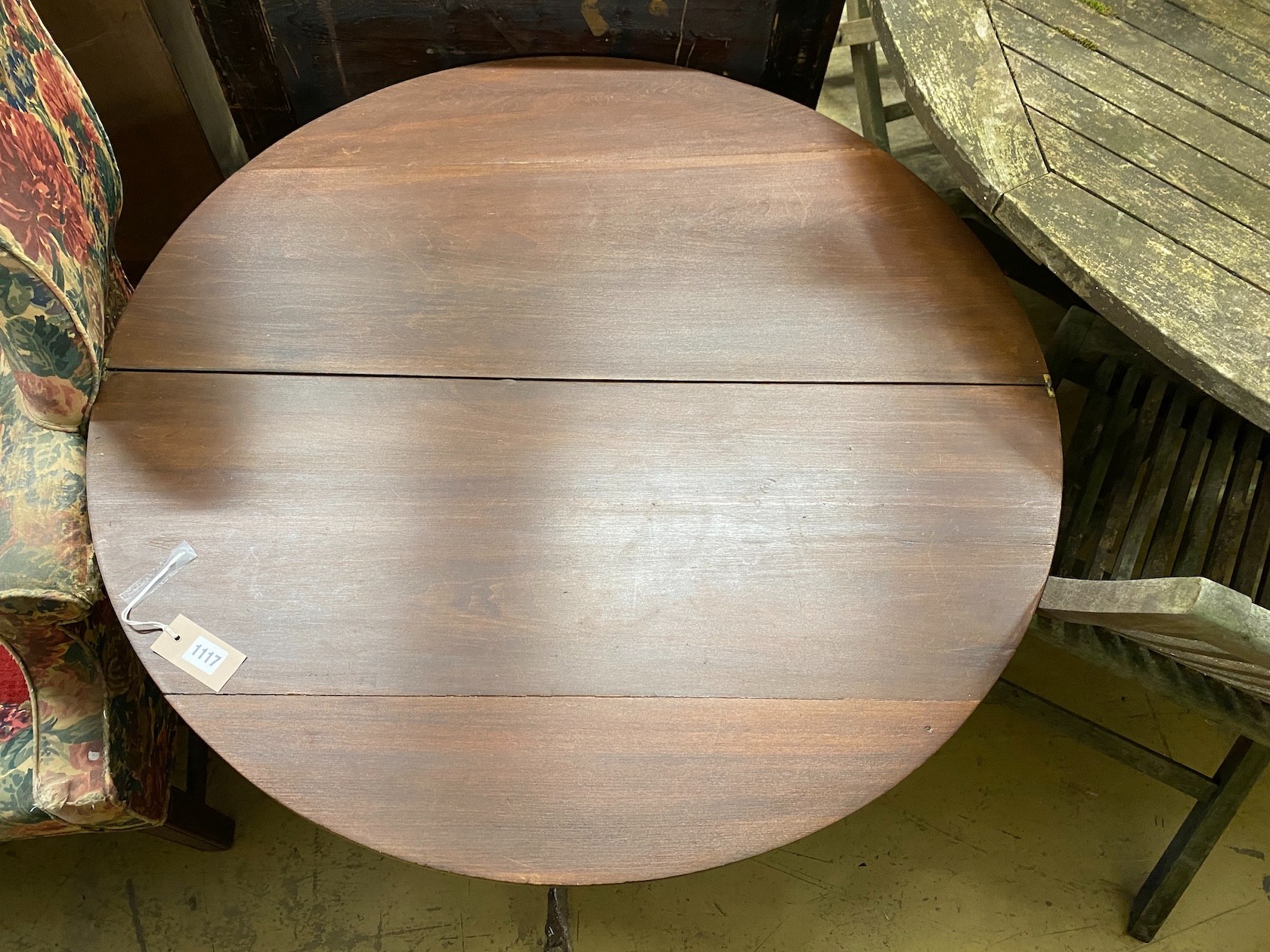 An early 20th century circular mahogany folding coaching table, diameter 91cm, height 63cm